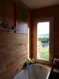 Maison  bois vue sur les volcans