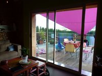 Maison  bois vue sur les volcans